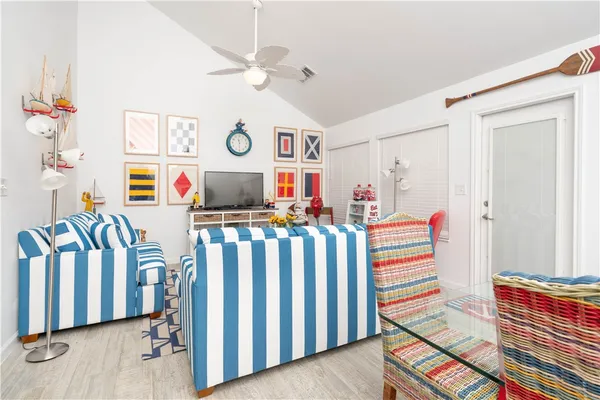 a bedroom with bed and a chandelier