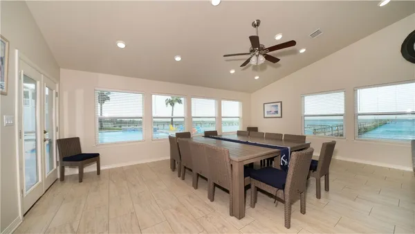 a view of a house with pool and lake view