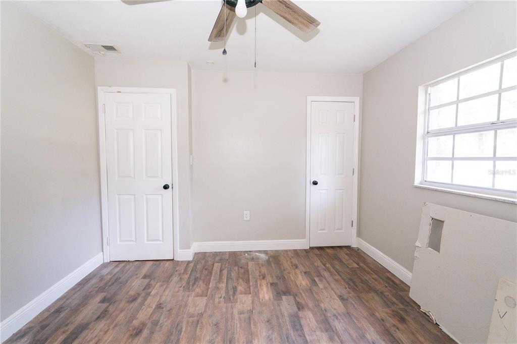 3102 Williams Road Brandon, FL 33510 - Photo 19 of 29 wooden floor in an empty room with a window