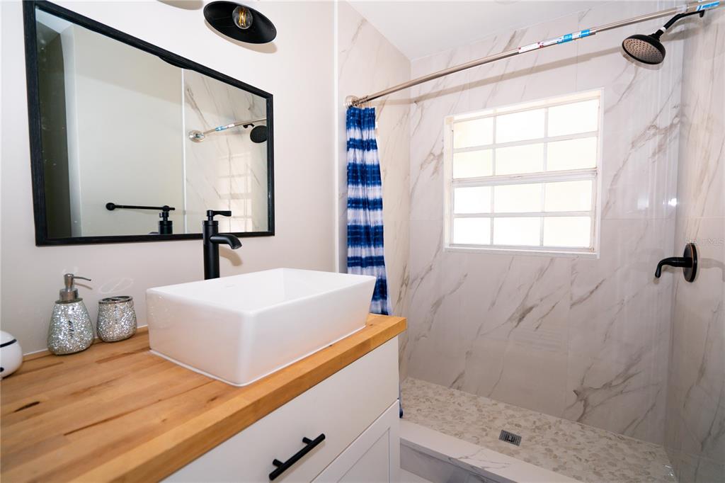 3102 Williams Road Brandon, FL 33510 - Photo 20 of 29 a bathroom with a sink and a mirror