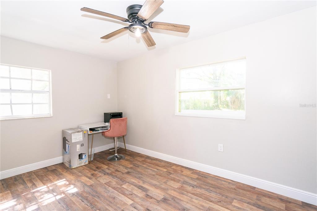 3102 Williams Road Brandon, FL 33510 - Photo 21 of 29 a view of a workspace with furniture and a window