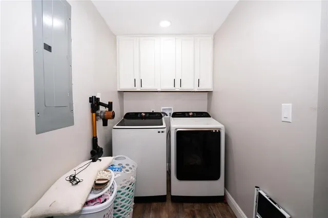 a kitchen with a stove and white cabinets