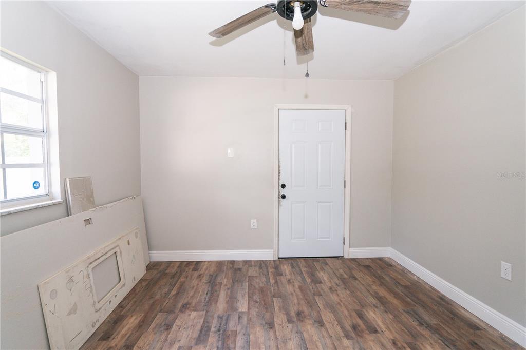 3102 Williams Road Brandon, FL 33510 - Photo 24 of 29 an empty room with a hardwood and ceiling fan