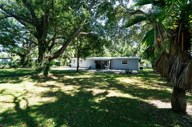a backyard of a house with lots of green space