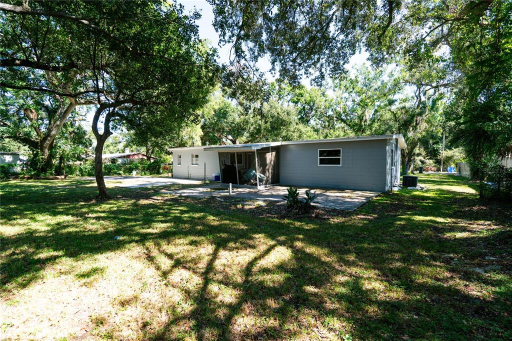 3102 Williams Road Brandon, FL 33510 - Photo 29 of 29 a view of a house with backyard and trees