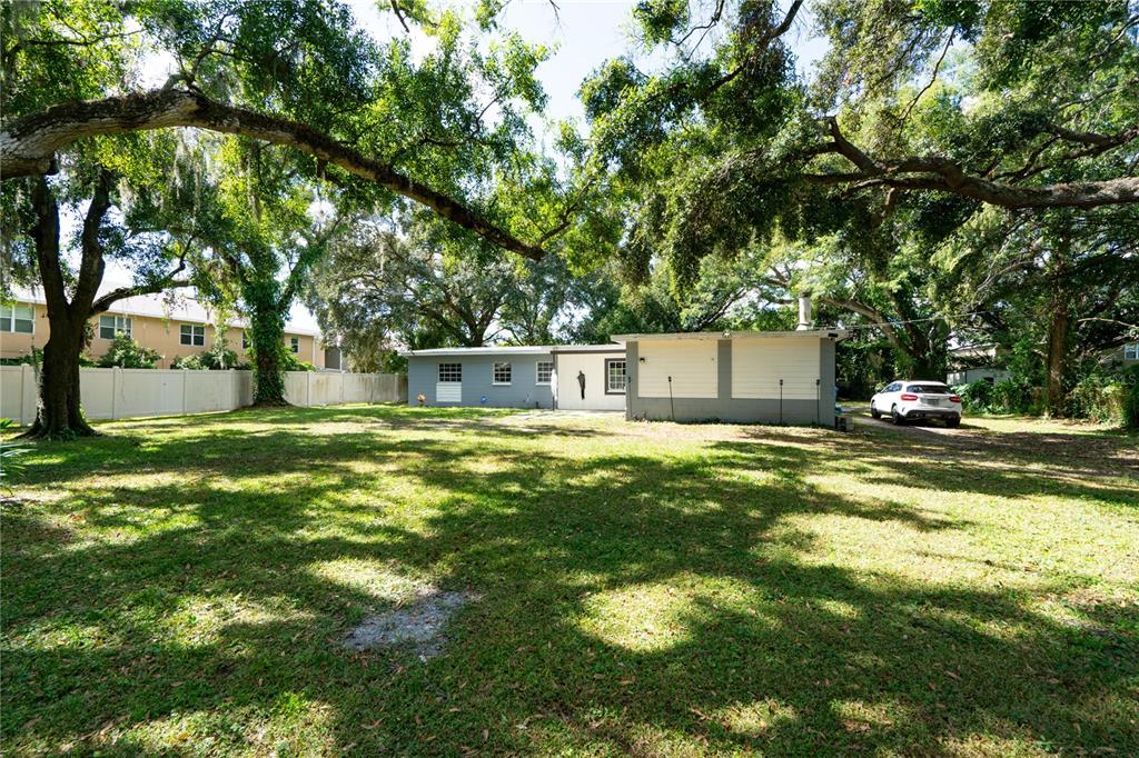 3102 Williams Road Brandon, FL 33510 - Photo 4 of 29 a swimming pool with outdoor seating and yard