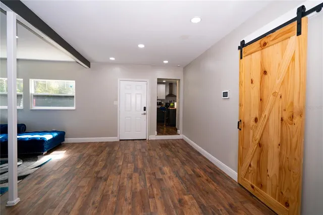 a view of an empty room and a window