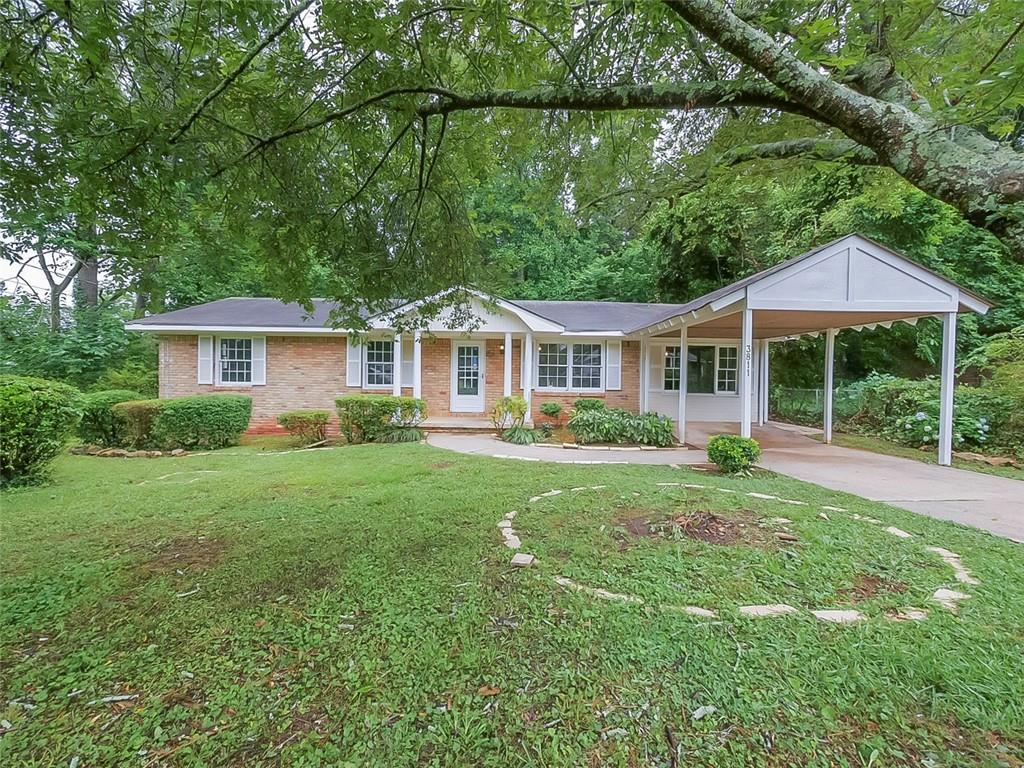3811 Brookcrest Circle Decatur, GA 30032 - Photo 1 of 1 a view of a house with a yard and sitting area