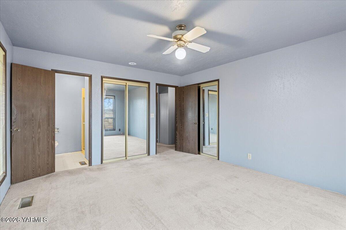 1861 North Cottonwood Road Yakima, WA 98908 - Photo 18 of 35 a view of a livingroom with a ceiling fan and window