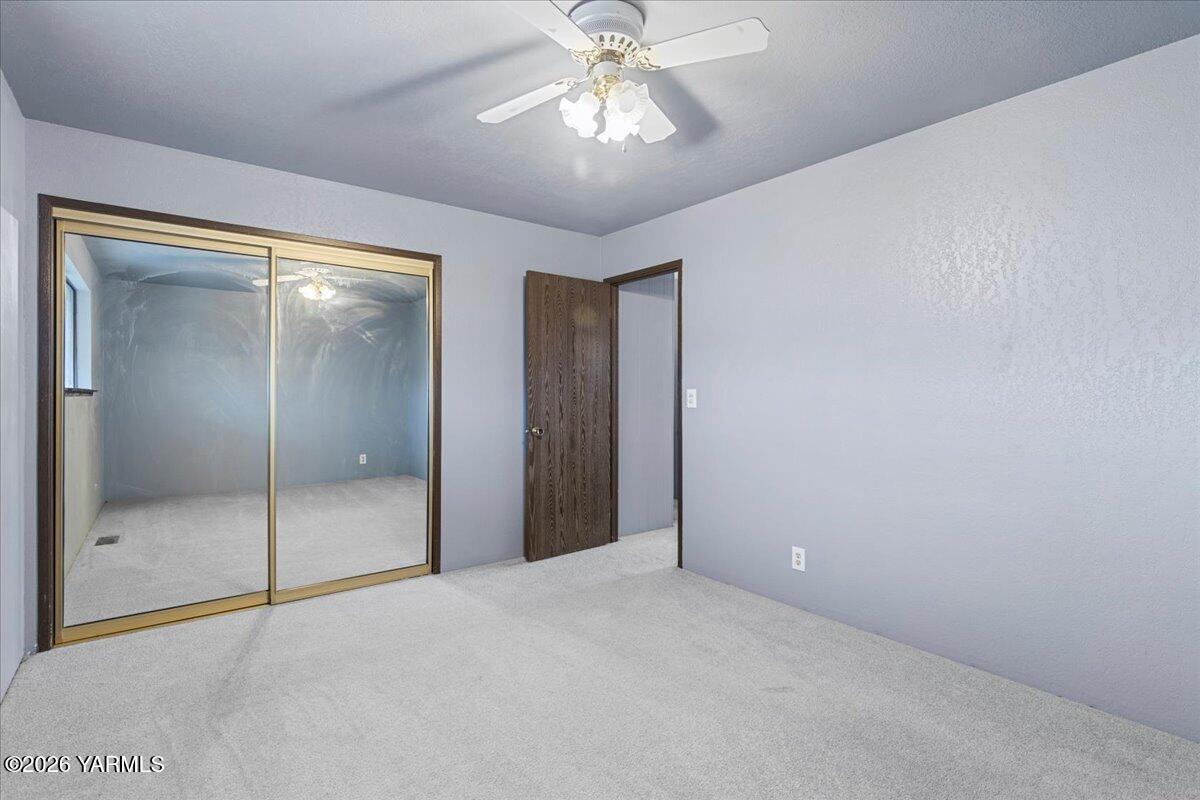 1861 North Cottonwood Road Yakima, WA 98908 - Photo 20 of 35 a view of an empty room and a chandelier fan