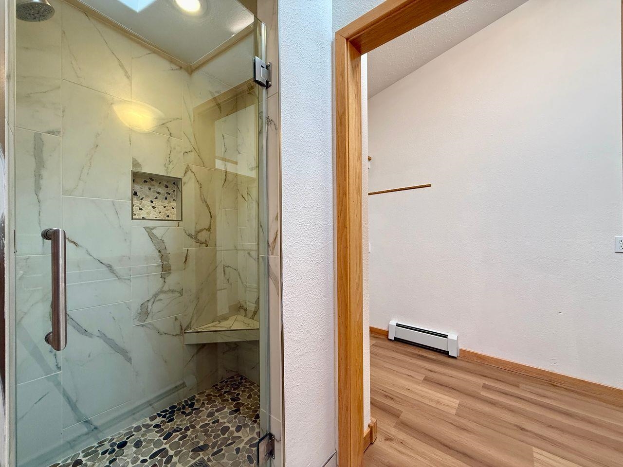 920 Crown Court Fruita, CO 81521 - Photo 20 of 42 a bathroom with a shower