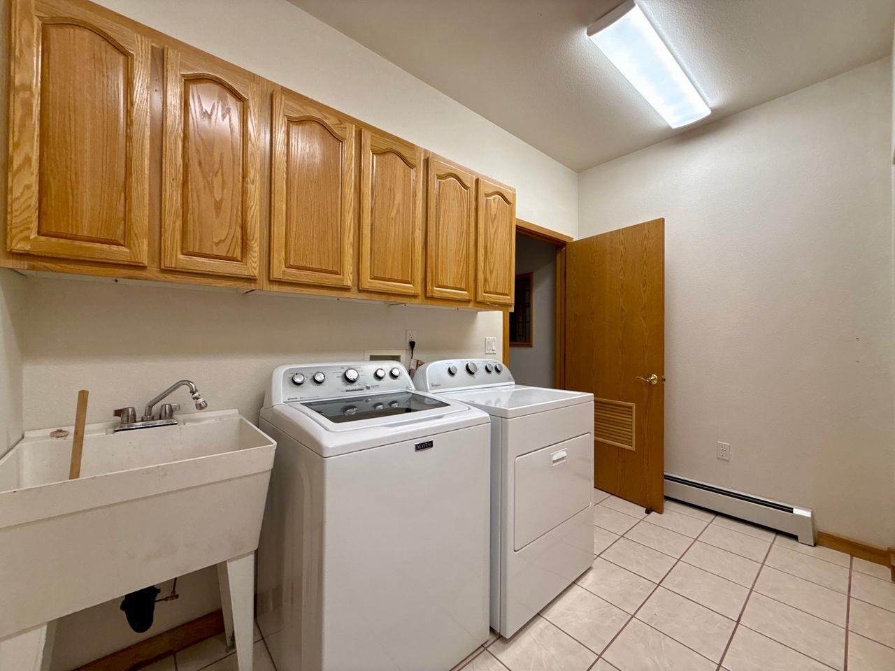 920 Crown Court Fruita, CO 81521 - Photo 27 of 42 a utility room with dryer and washer