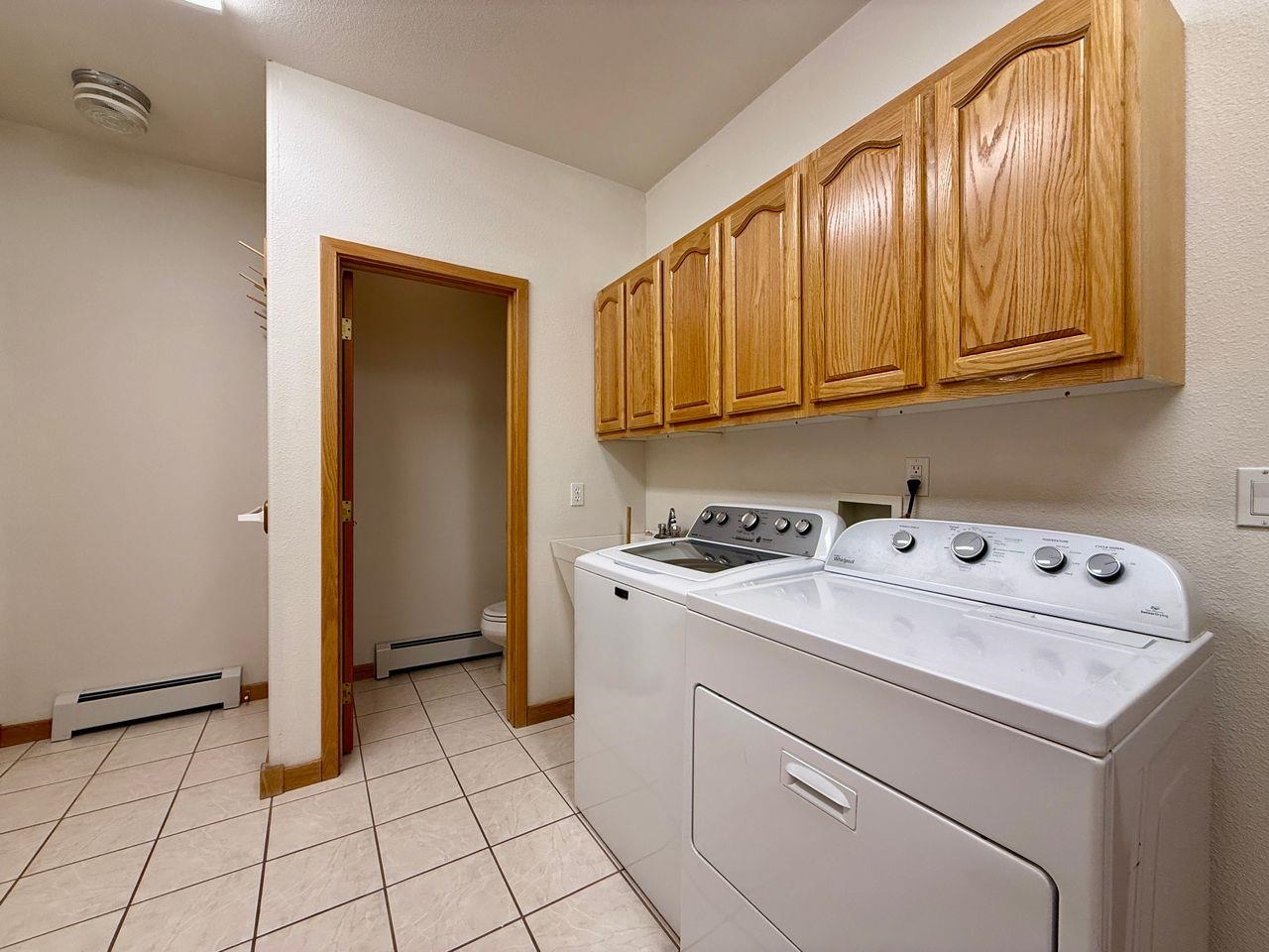920 Crown Court Fruita, CO 81521 - Photo 28 of 42 a utility room with dryer and washer