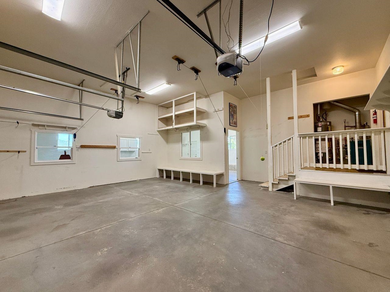 920 Crown Court Fruita, CO 81521 - Photo 31 of 42 a view of an empty room with stairs and a ceiling fan