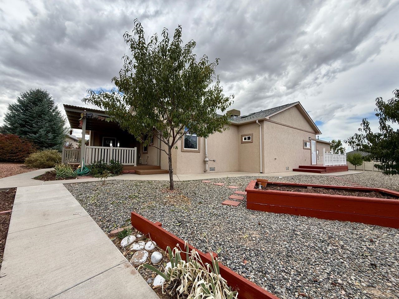 920 Crown Court Fruita, CO 81521 - Photo 39 of 42 a front view of house with small garden