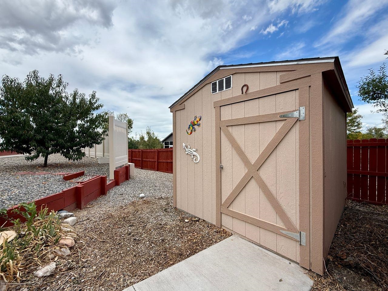 920 Crown Court Fruita, CO 81521 - Photo 42 of 42 a view of a pathway of a house with a yard