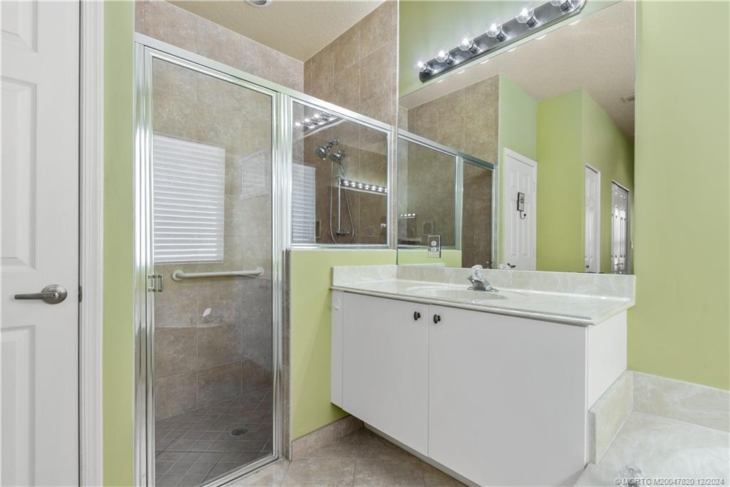 2031 Northwest Marsh Rabbit Lane Stuart, FL 34994 - Photo 19 of 25 Main Bathroom