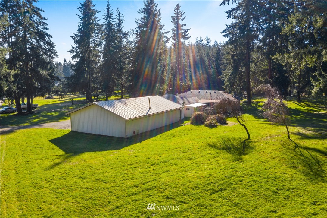 16631 Jordan Street Southwest Rochester, WA 98579 - Photo 8 of 39 a view of swimming pool with a yard
