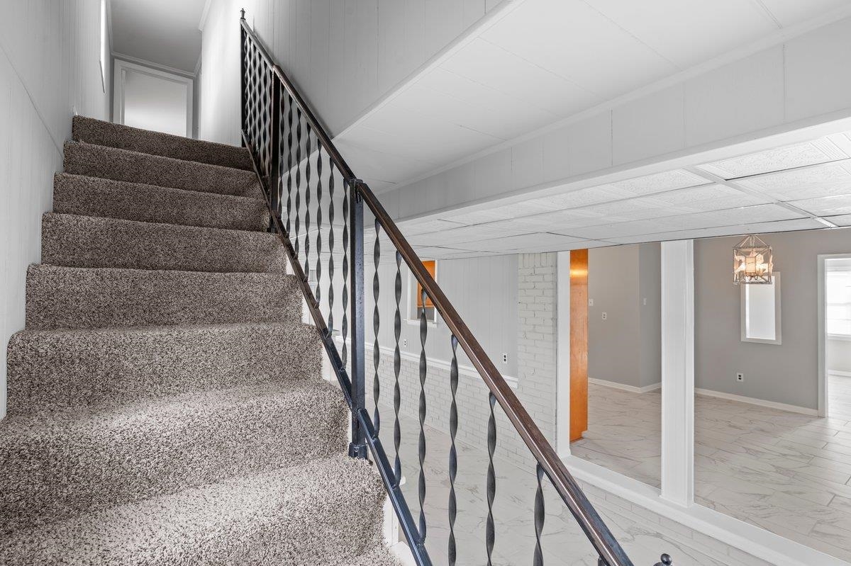 4948 Knight Arnold Road Memphis, TN 38118 - Photo 16 of 27 Stairs with marble look tiles