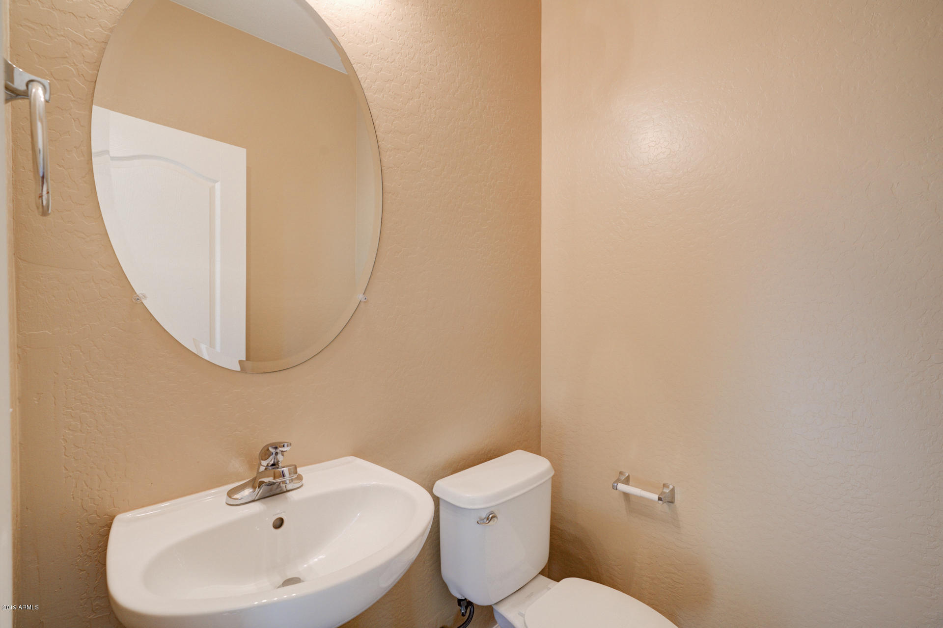 1891 South Racine Lane Gilbert, AZ 85295 - Photo 11 of 35 a bathroom with a sink mirror and toilet