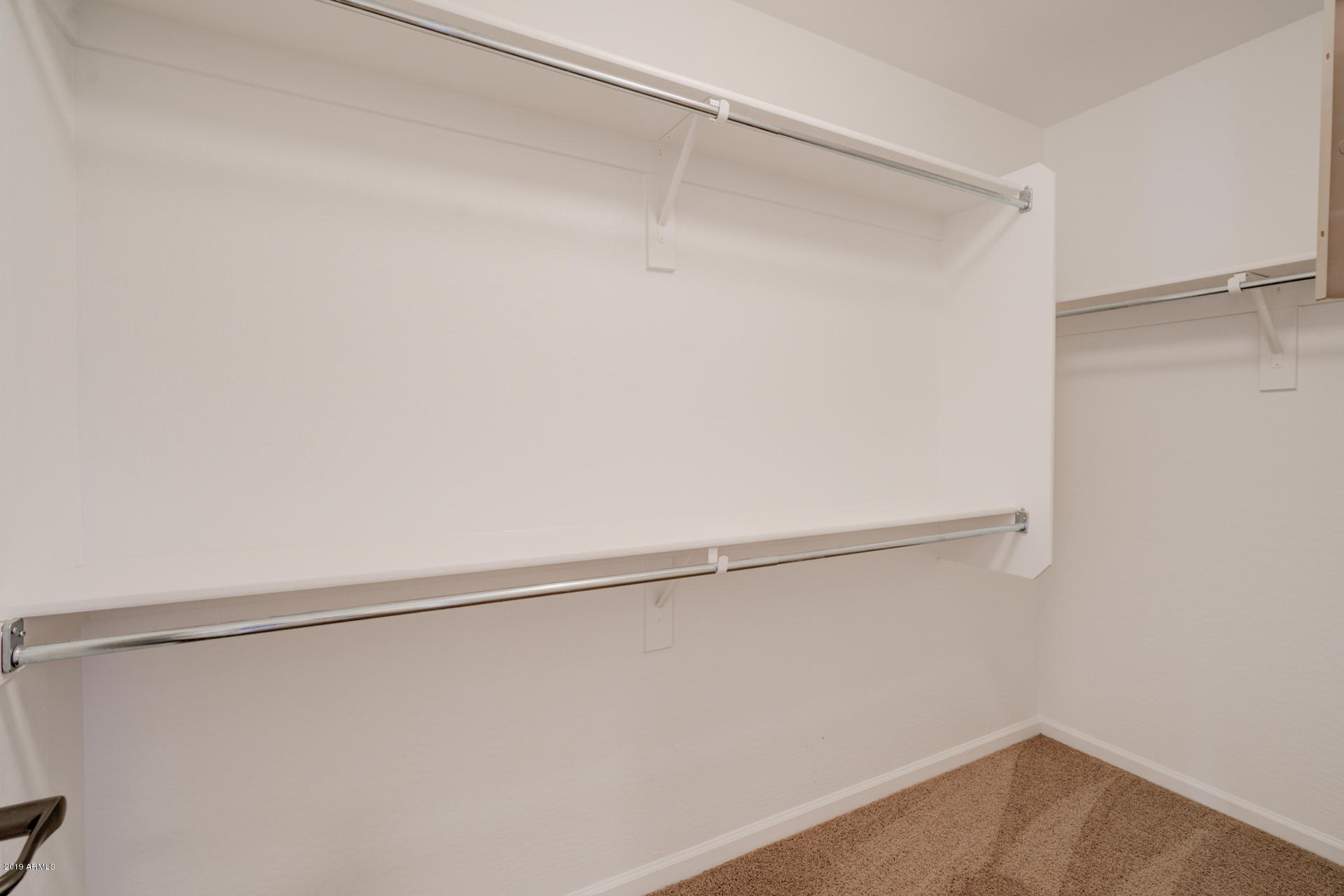 1891 South Racine Lane Gilbert, AZ 85295 - Photo 19 of 35 a view of a room with racks on the wall