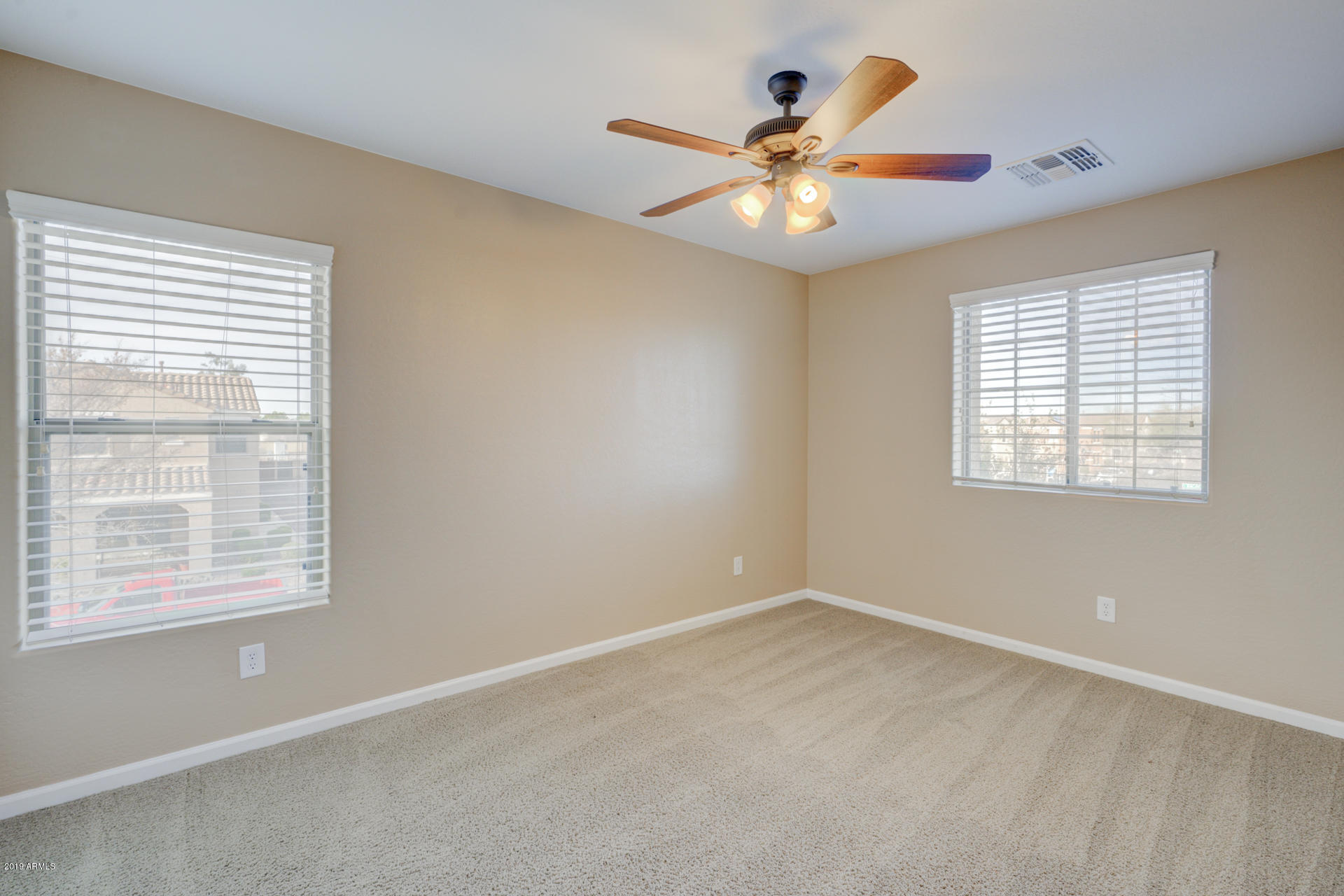 1891 South Racine Lane Gilbert, AZ 85295 - Photo 20 of 35 an empty room with window and fan