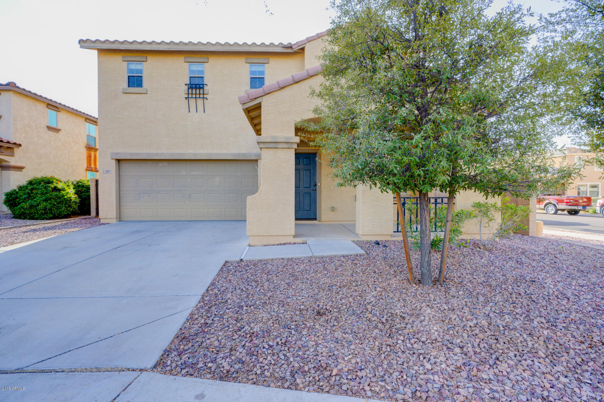 1891 South Racine Lane Gilbert, AZ 85295 - Photo 2 of 35 front view of a house with a yard and garage