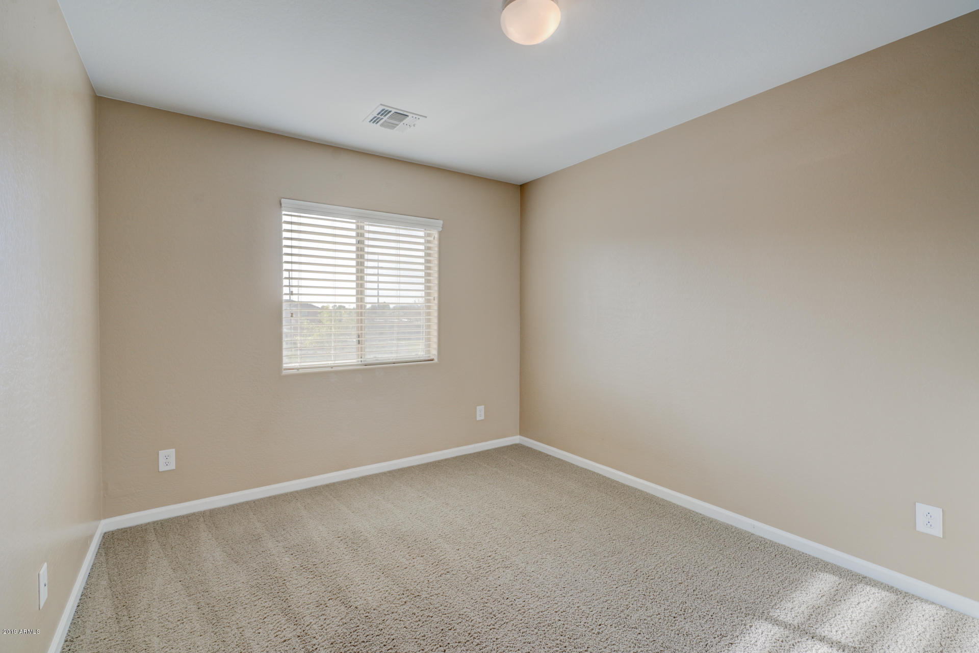 1891 South Racine Lane Gilbert, AZ 85295 - Photo 23 of 35 an empty room with a window