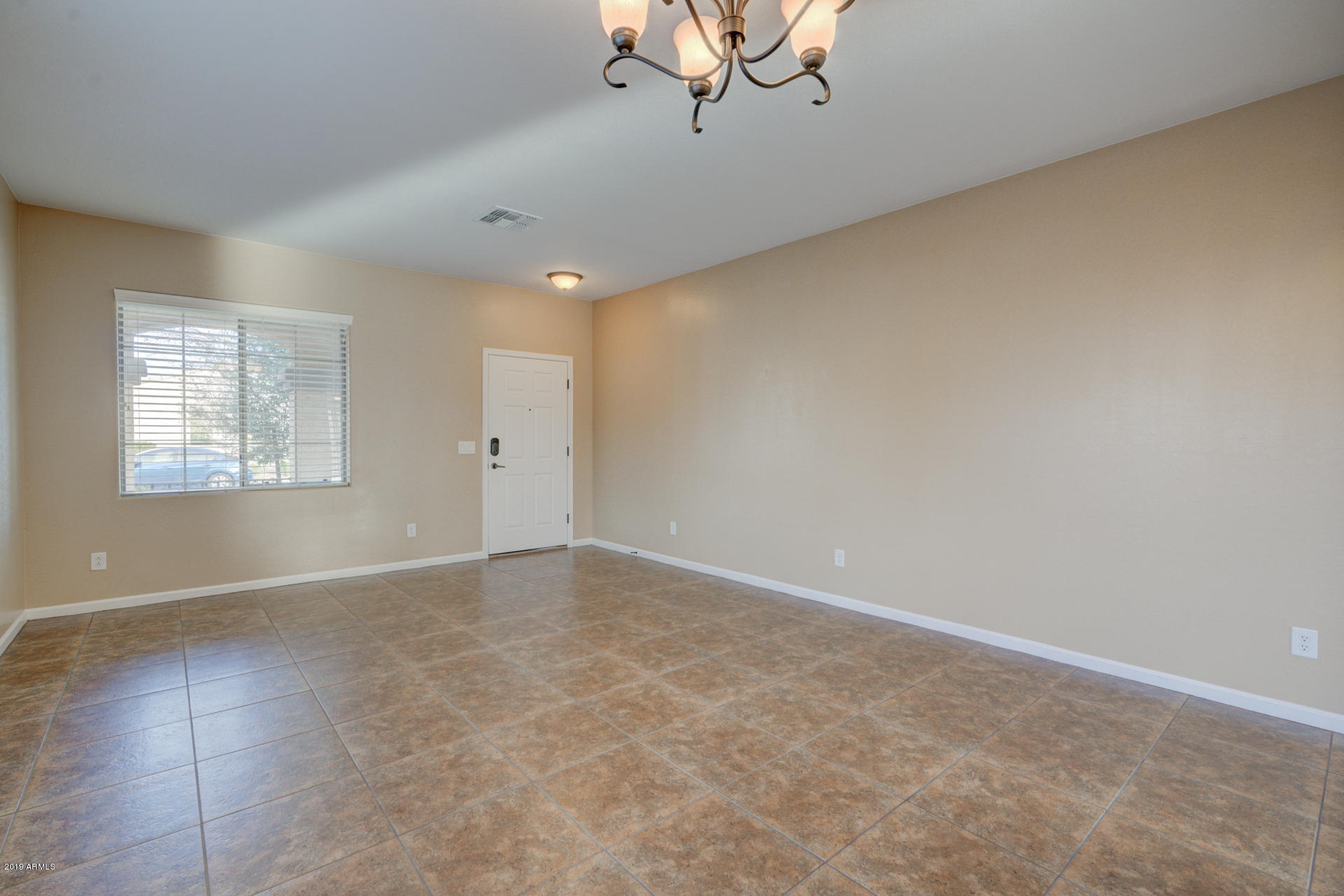 1891 South Racine Lane Gilbert, AZ 85295 - Photo 5 of 35 a view of an empty room with a window