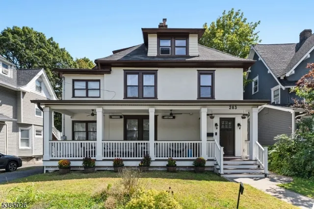 front view of a house with a yard