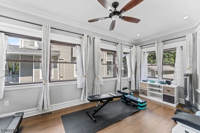 a view of a livingroom with workspace and a window