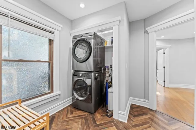 a view of a storage and utility room with washer and dryer