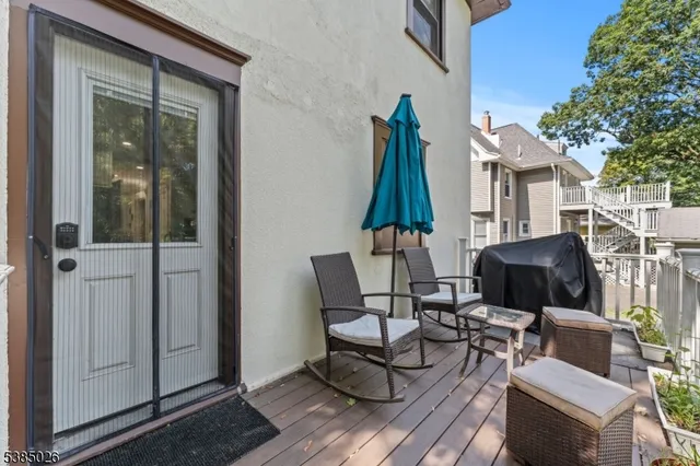 a view of a patio with couple of chairs