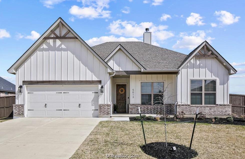5013 Greenstone Way Bryan, TX 77802 - Photo 1 of 11 a front view of a house with garden