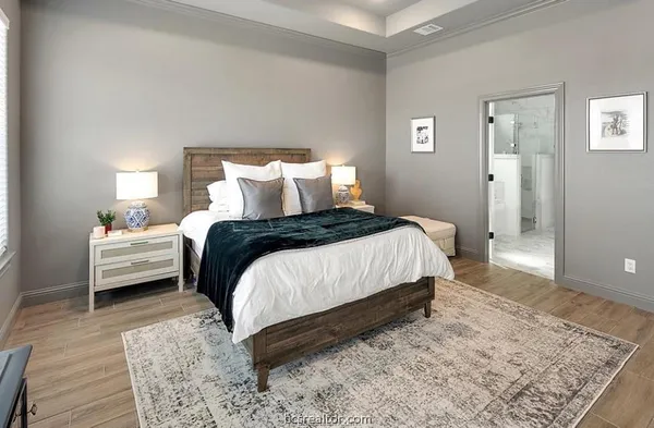 a bedroom with a bed and a couch