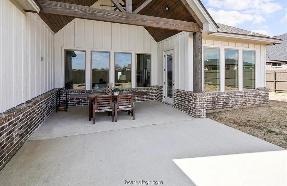 5013 Greenstone Way Bryan, TX 77802 - Photo 6 of 11 a balcony with furniture and large window