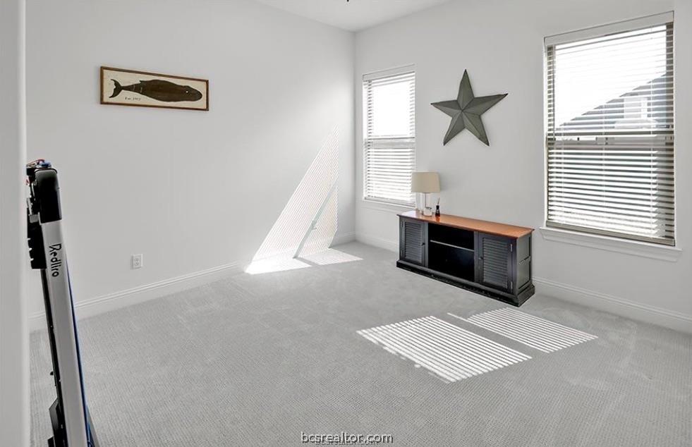 5013 Greenstone Way Bryan, TX 77802 - Photo 7 of 11 a view of an empty room with a window
