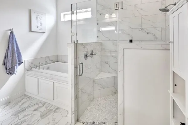 a bathroom with a shower and a sink