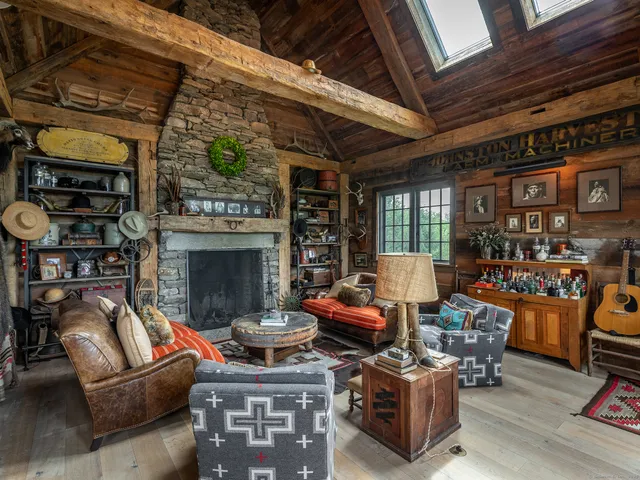 a outdoor living space with patio furniture and a fireplace