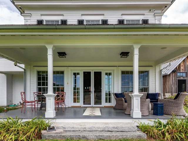 a view of a swimming pool with outdoor seating