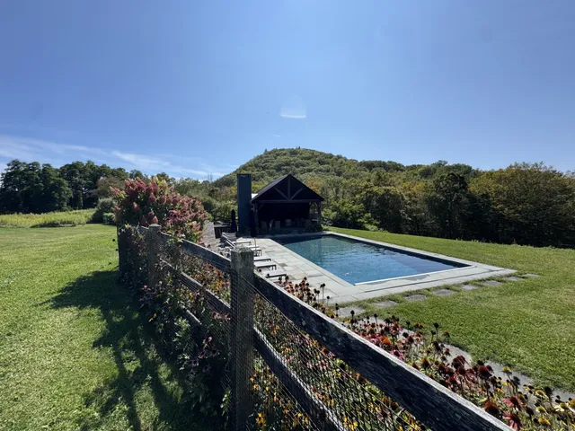 a view of a balcony with an outdoor space and seating area
