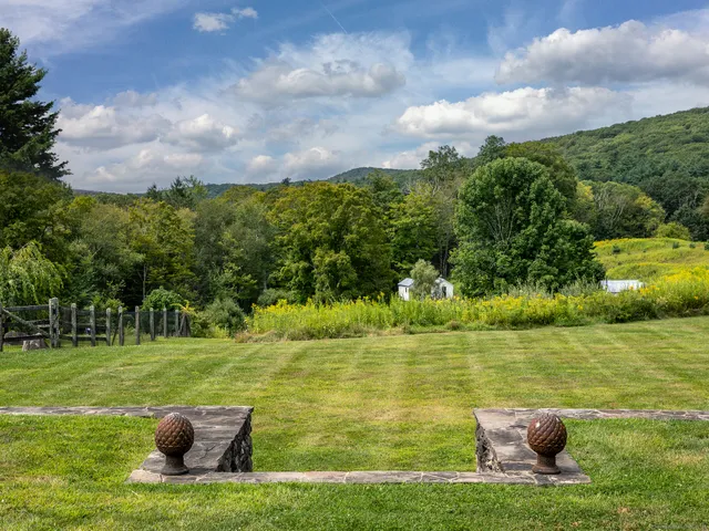 a view of a lake with a big yard