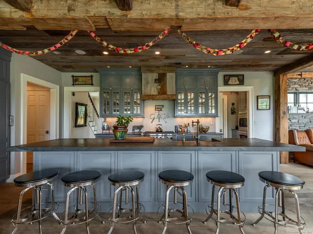 a kitchen with a table and chairs in it