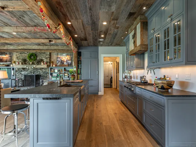 a kitchen with stainless steel appliances granite countertop counter space a sink and cabinets