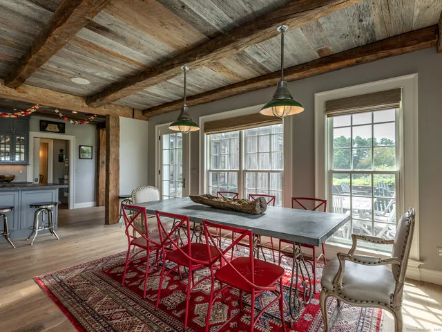 a outdoor dining space with furniture and window