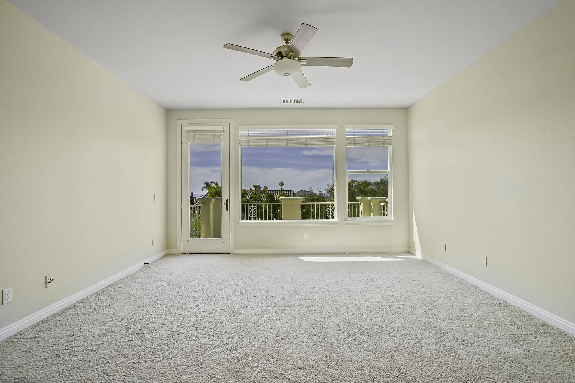 7065 Crystalline Drive Carlsbad, CA 92011 - Photo 11 of 26 a view of an empty room with a window