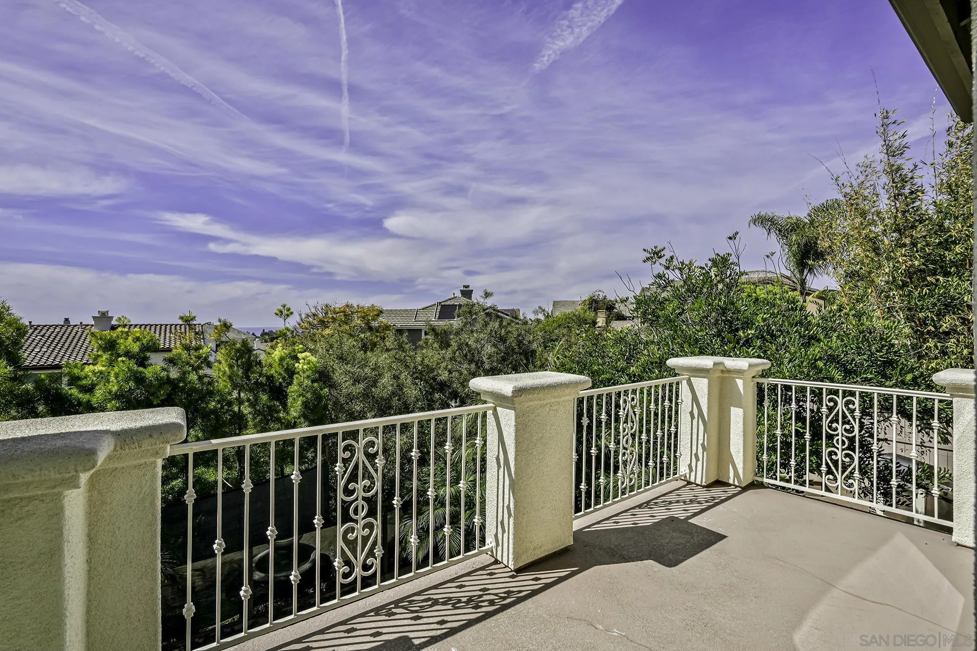 7065 Crystalline Drive Carlsbad, CA 92011 - Photo 12 of 26 a balcony with wooden floor and fence