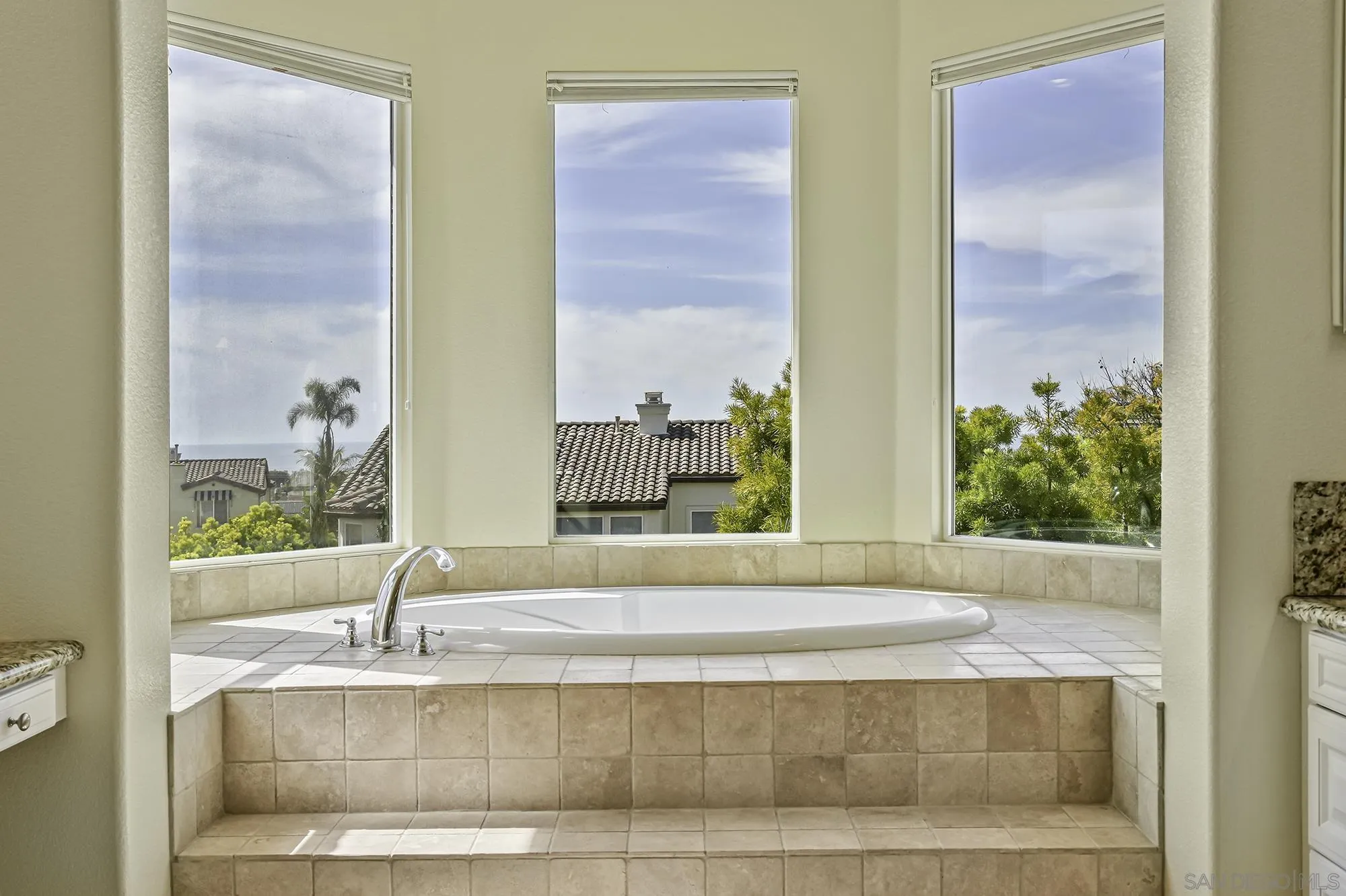7065 Crystalline Drive Carlsbad, CA 92011 - Photo 15 of 26 a view of a bathroom with mirror and window
