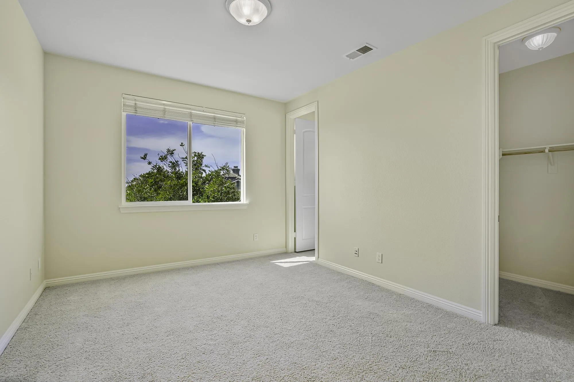 7065 Crystalline Drive Carlsbad, CA 92011 - Photo 17 of 26 an empty room with window