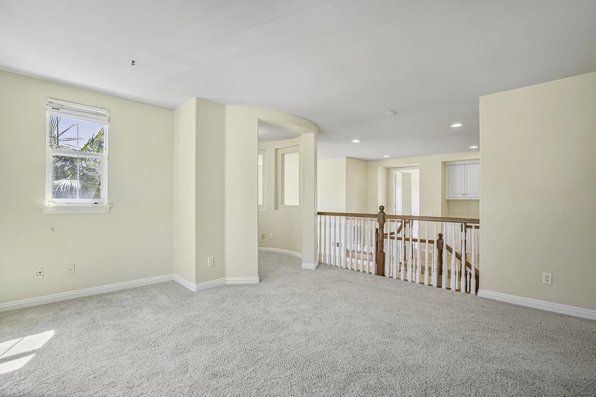 7065 Crystalline Drive Carlsbad, CA 92011 - Photo 19 of 26 a view of an empty room with a window